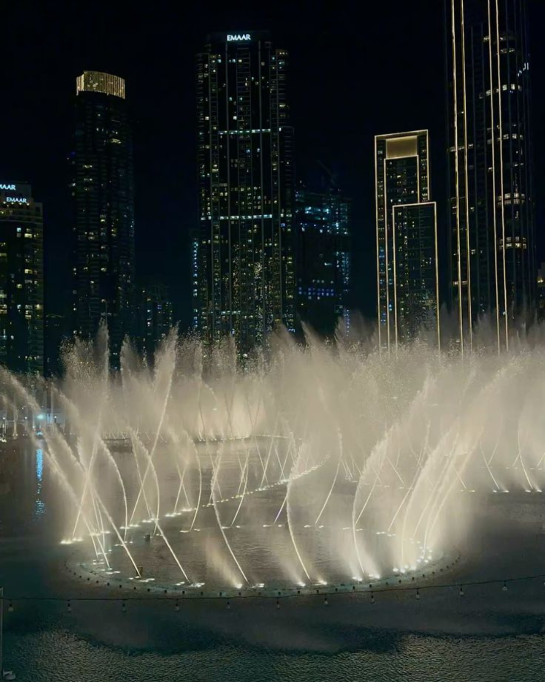 Dubai Mall Fountains and at the top Burj Khalifa